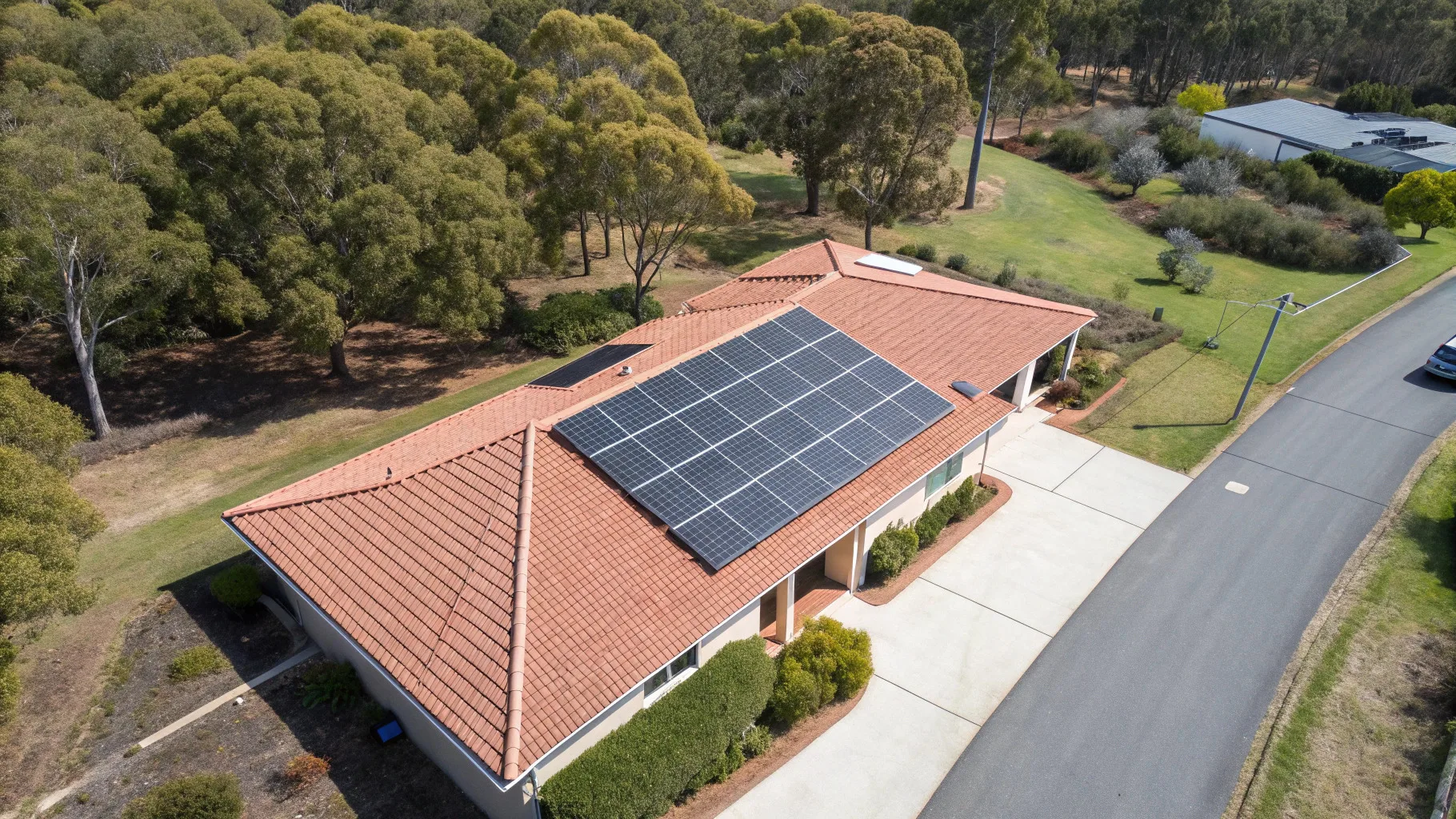 Aerial view of a home with a fully installed rooftop solar panel array